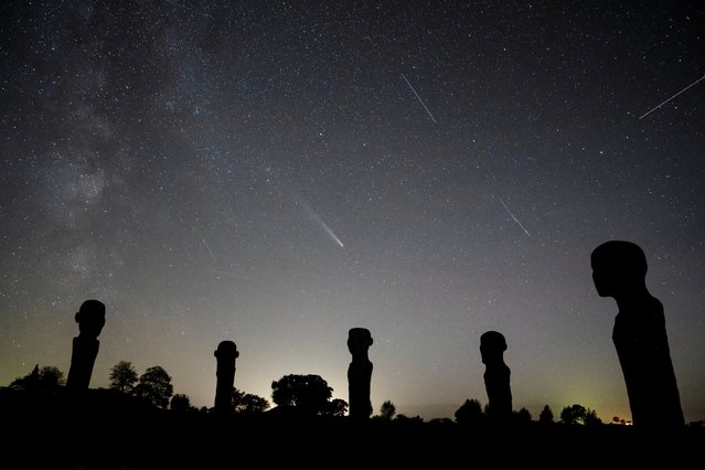 Comet C/2023 A3 - Tsuchinshan-ATLAS is seen in the sky above the artwork Dodekalitten at Lolland southern Zealand, Denmark on October 22, 2024. (Photo by Mads Claus Rasmussen/Ritzau Scanpix via AFP Photo)