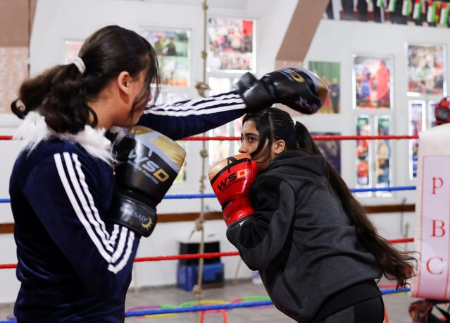 Palestinian girl boxers trade jabs and punches during a training inside the first women boxing center in Gaza City on January 17, 2023. (Photo by Mohammed Salem/Reuters)