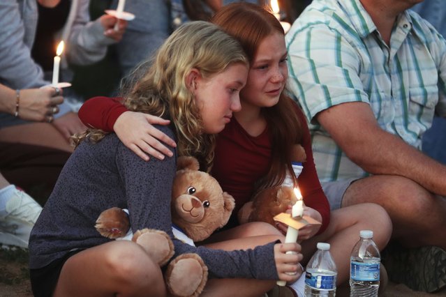People gather at a vigil at Lynnhurst Park after a shooting at the Annunciation Catholic School, Wednesday, August 27, 2025, in Minneapolis. (Photo by Bruce Kluckhohn/AP Photo)