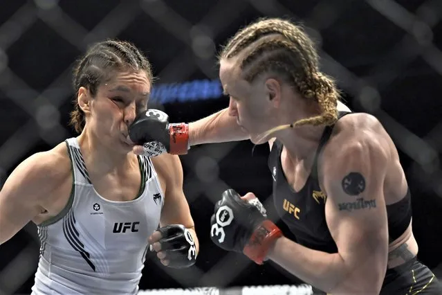 Alexa Grasso, left, is hit by Valentina Shevchenko during a UFC 285 mixed martial arts flyweight title bout Saturday, March 4, 2023, in Las Vegas. (Photo by David Becker/AP Photo)