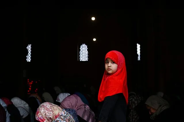Muslim devotees offer first Friday prayers of the holy fasting month of Ramadan at the Jamia Masjid in downtown Srinagar on March 24, 2023. (Photo by Tauseef Mustafa/AFP Photo)
