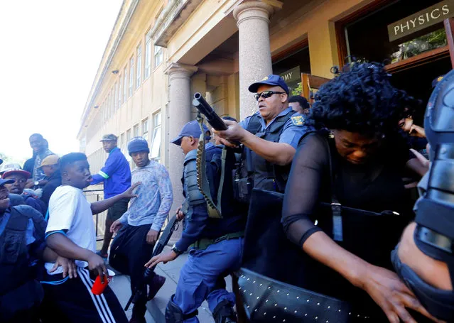 University of Cape Town students clash with police as stun grendes are used during protests demanding free tertiary education in Cape Town, South Africa, October 17, 2016. (Photo by Mike Hutchings/Reuters)