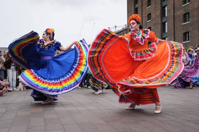 Mexican folk dancers performing during a Day Of The Dead event in King's Cross, London on Sunday, October 26, 2025. (Photo by Lucy North/PA Images via Getty Images)