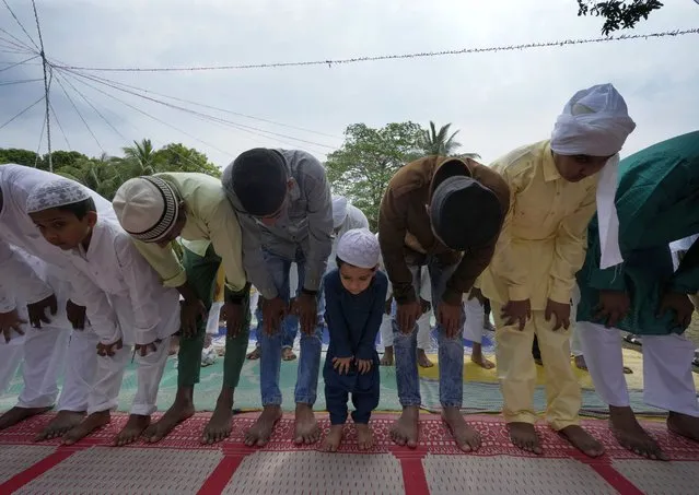 Muslims offer Eid al-Fitr prayer marking the end of the holy fasting month of Ramadan in Guwahati, India, Saturday, April 22, 2023. (Photo by Anupam Nath/AP Photo)