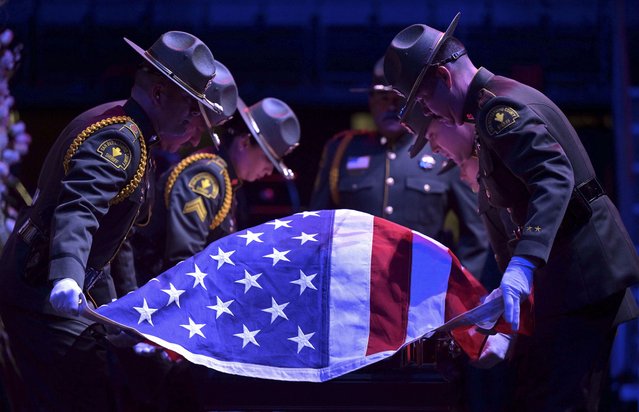 A San Bernardino County sheriff's Honor Guard fold a flag atop slain deputy Andrew Nunez's casket during funeral services at Toyota Arena in Ontario, Calif., Tuesday, November 18, 2025. (Photo by Will Lester/The Orange County Register via AP Photo)