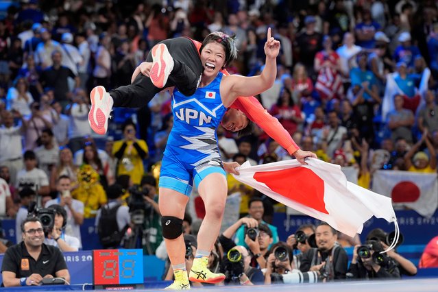 Japan's Yuka Kagami celebrates after defeating Kennedy Alexis Blades, of the United States, in their women's freestyle 76kg final wrestling match, at Champ-de-Mars Arena, during the 2024 Summer Olympics, Sunday, August 11, 2024, in Paris, France. (Photo by Eugene Hoshiko/AP Photo)