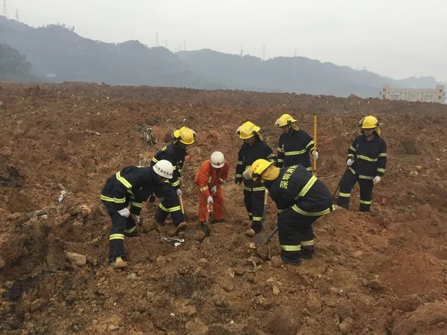 Rescuers search for survivors at the site of a landslide at an industrial park in Shenzhen, Guangdong province, China, December 20, 2015. (Photo by Reuters/Stringer)