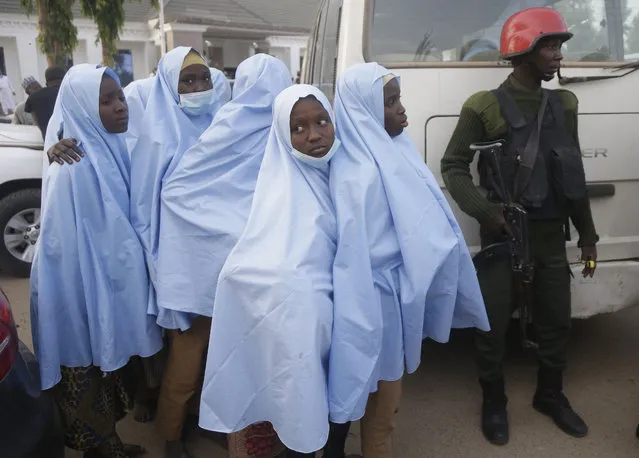 Some of the students who were abducted by gunmen from the Government Girls Secondary School, in Jangebe, last week wait for a medical checkup after their release meeting with the state Governor Bello Matawalle, in Gusau, northern Nigeria, Tuesday, March 2, 2021. Zamfara state governor Bello Matawalle announced that 279 girls who were abducted last week from a boarding school in the northwestern Zamfara state have been released Tuesday. (Photo by Sunday Alamba/AP Photo)