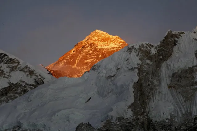 In this November 12, 2015, file photo, Mt. Everest is seen from the way to Kalapatthar in Nepal. An American climber has died near the summit of Mount Everest and an Indian climber is missing after heading down from the mountain following a successful ascent, expedition organizers said Sunday. (Photo by Tashi Sherpa/AP Photo)