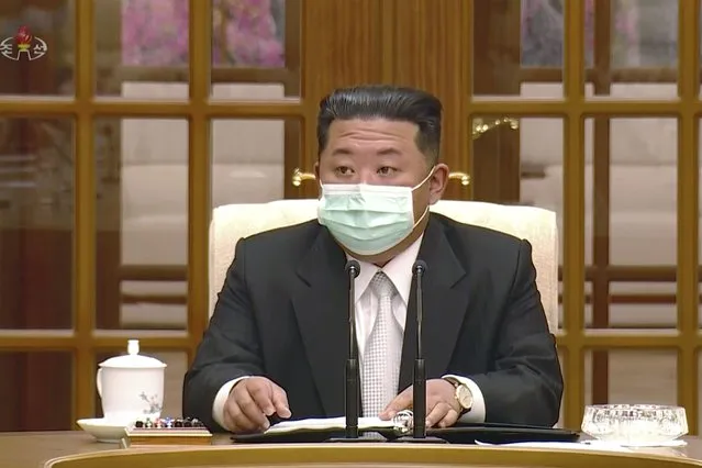 In this image made from video broadcasted by North Korea's KRT, North Korean leader Kim Jong Un wears a face mask on state television during a meeting acknowledging the country's first case of COVID-19 Thursday, May 12, 2022, in Pyongyang, North Korea. North Korea imposed a nationwide lockdown Thursday to control its first acknowledged COVID-19 outbreak after holding for more than two years to a widely doubted claim of a perfect record keeping out the virus that has spread to nearly every place in the world. (Photo by KRT via AP Photo)