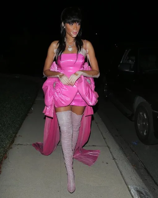 Canadian fashion model Winnie Harlow looks sensational in hot pink as she steps out for the evening in Los Angeles, CA. on January 30, 2021. Winnie looked chic in a hot pink mini dress with a huge bow on the side designed by Christian Cowan paired with knee-high sparkling pink boots and a matching pink Chanel purse. She accessorized the look with a custom diamond pendant from the Milana B. Jewelry Collection. She also showcased a new hair-do. Winnie looked stunning but appeared to be missing a necessary accessory, a mask. (Photo by Backgrid USA)