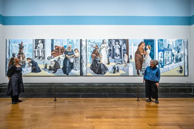 Lizzie Perrotte and Ailsa Bhattacharya, two of the original muses with their parts in the mural – Paula Rego: Crivelli's Garden (pictured) at the National Gallery in London on July 18, 2023. As the National Gallery's first Associate Artist (1990-92), she was invited to create the mural for the Sainsbury Wing Dining Room. This new exhibition unites the 10-metre-long artwork with the 15th-century altarpiece by Carlo Crivelli that inspired it, alongside life studies Rego produced of the Gallery colleagues that feature in the final painting. (Photo by Guy Bell/Rex Features/Shutterstock)