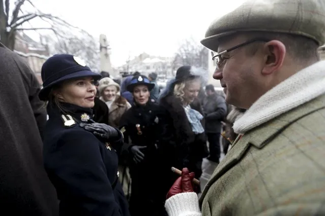 People dress up as characters from Scottish writer Arthur Conan Doyle's stories as they celebrate the birthday of detective Sherlock Holmes, one of Doyle's most famous fictional character, in Riga, Latvia, January 9, 2016. (Photo by Ints Kalnins/Reuters)