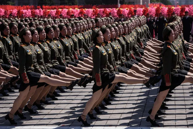 Korean People's Army (KPA) soldiers march during a mass rally on Kim Il Sung square in Pyongyang on September 9, 2018. Thousands of North Korean troops followed by artillery and tanks paraded through Pyongyang on September 9 as the nuclear-armed country celebrated its 70th birthday, but it refrained from displaying the intercontinental ballistic missiles that have seen it hit with sanctions. (Photo by Ed Jones/AFP Photo)