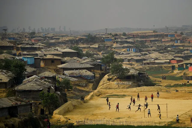 Rohingya refugees play football at Kutupalong refugee camp in Cox's Bazaar, Bangladesh, March 27, 2018. (Photo by Clodagh Kilcoyne/Reuters)