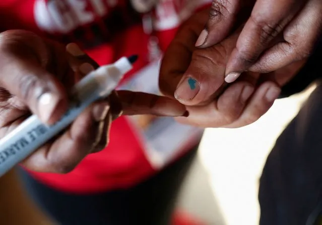 A person gets their finger marked at a polling station during the Eswatini's parliamentary elections in Mbabane, Eswatini on September 29, 2023. (Photo by Esa Alexander/Reuters)