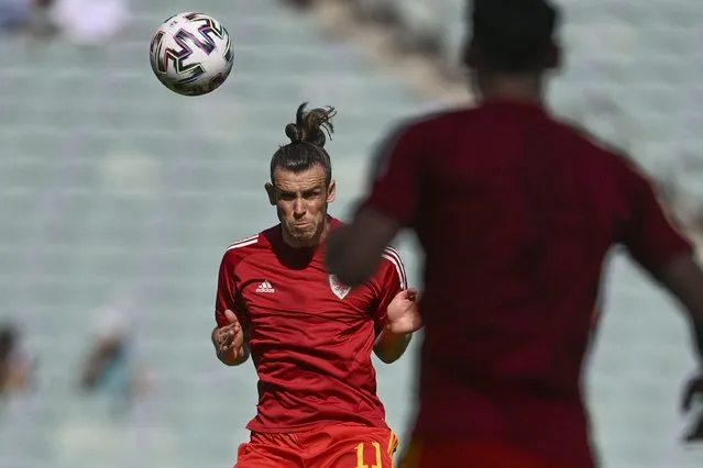 Wales' Gareth Bale heads the ball prior to the Euro 2020 soccer championship group A match between Wales and Switzerland, at the Baku Olympic stadium, in Baku, Azerbaijan, Saturday, June 12, 2021. (Photo by Ozan Kose/Pool via AP Photo)