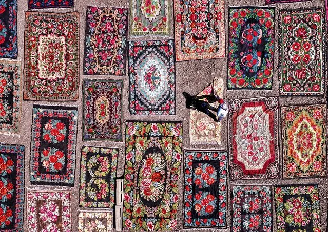 Hundreds of second-hand rugs are left out in the sun to dry after being washed and treated in Antalya, Turkey in October 2023. (Photo by F. Dilek Uyar/Solent News)
