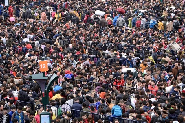 People wait to enter Guangzhou Railway Station in Guangzhou, Guangdong province, China, February 2, 2016. (Photo by Reuters/Stringer)