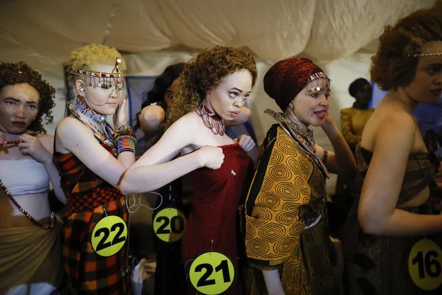 Albino women prepare backstage prior to their fashion show during the Mr. & Miss Albinism East Africa contest in Nairobi, Kenya, 30 November 2018. (Photo by Dai Kurokawa/EPA/EFE)