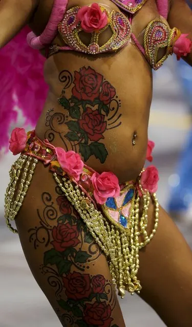 A reveller parades for Rosas de Ouro samba school during carnival in Sao Paulo, Brazil, February 6, 2016. (Photo by Paulo Whitaker/Reuters)