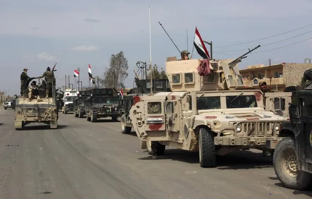 Iraqi security forces deploy in Tikrit, 80 miles (130 kilometers) north of Baghdad, Iraq, Wednesday, April 1, 2015. (Photo by Khalid Mohammed/AP Photo)