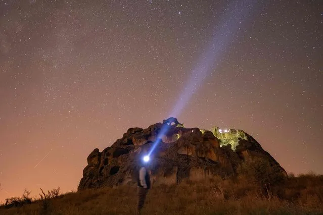 This photograph taken on on August 13, 2023, shows a view of the sky during the Perseid meteor shower over the historical Phrygian Valley near Ihsaniye, in the Afyonkarahisar district. (Photo by Yasin Akgul/AFP Photo)