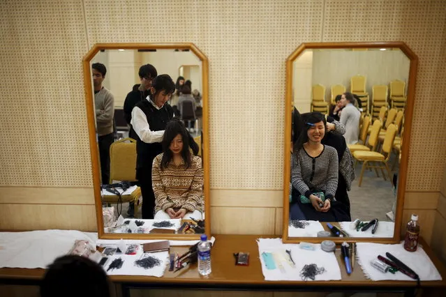 Japanese brides receive a makeover as they prepare for the upcoming mass wedding ceremony of the Unification Church at a resort in Yangpyeong, South Korea, February 19, 2016. (Photo by Kim Hong-Ji/Reuters)