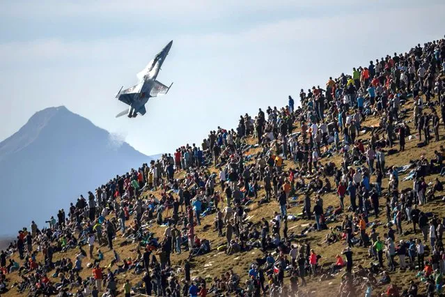A McDonnell Douglas F/A-18 Hornet of the Swiss Air Force performs during the annual live fire event over the Axalp in the Bernese Oberland, on October 19, 2022. At an altitude of 2,200 meters above sea level, spectators attended a unique aviation display performed at the highest air force firing range in Europe. (Photo by Fabrice Coffrini/AFP Photo)