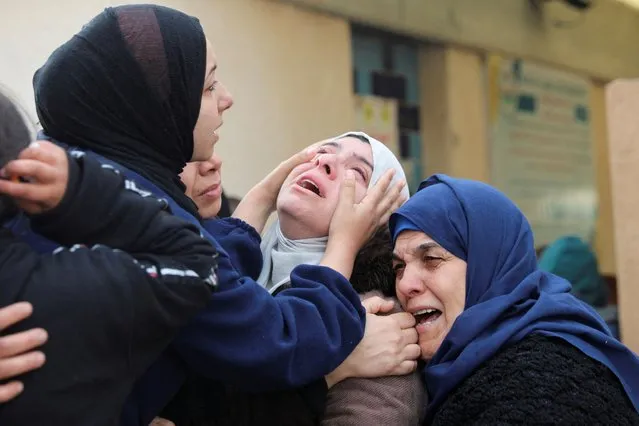 Mourners react during the funeral of Palestinians killed in an Israeli strike, amid the ongoing conflict between Israel and Palestinian Islamist group Hamas, in Khan Younis in the southern Gaza Strip on January 12, 2024. (Photo by Arafat Barbakh/Reuters)