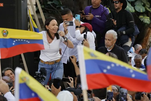 Opposition coalition presidential hopeful Maria Corina Machado speaks to supporters at a campaign event in Caracas, Venezuela, Tuesday, January 23, 2024. An election date has not been set yet, when the opposition's one candidate, Machado, will run against current President Nicolas Maduro. (Photo by Jesus Vargas/AP Photo)