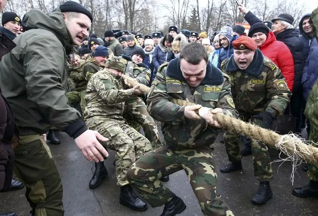 Servicemen of the Belarussian Interior Ministry's special forces unit compete during Maslenitsa celebrations, a pagan holiday marking the end of winter  celebrated with pancake eating and shows of strength, at their base in Minsk, Belarus February 19, 2017. (Photo by Vasily Fedosenko/Reuters)
