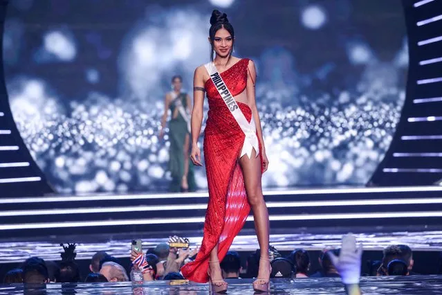 Miss Philippines, Beatrice Gomez, presents herself on stage during the preliminary stage of the 70th Miss Universe beauty pageant in Israel's southern Red Sea coastal city of Eilat on December 10, 2021. (Photo by Menahem Kahana/AFP Photo)