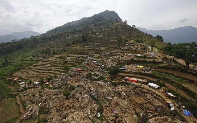 An aerial view of Hagam village in Sindhupalchwok district after another powerful earthquake struck Nepal, 15 May 2015. The death toll from the 12 May earthquake rose to 117, authorities said, separate from the 8,202 victims claimed by the April 25 earthquake. (Photo by Narendra Shrestha/EPA)