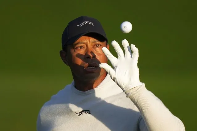 Tiger Woods catches a golf ball on the driving range during a practice round in preparation for the Masters golf tournament at Augusta National Golf Club Monday, April 8, 2024, in Augusta, Ga. (Photo by Matt Slocum/AP Photo)