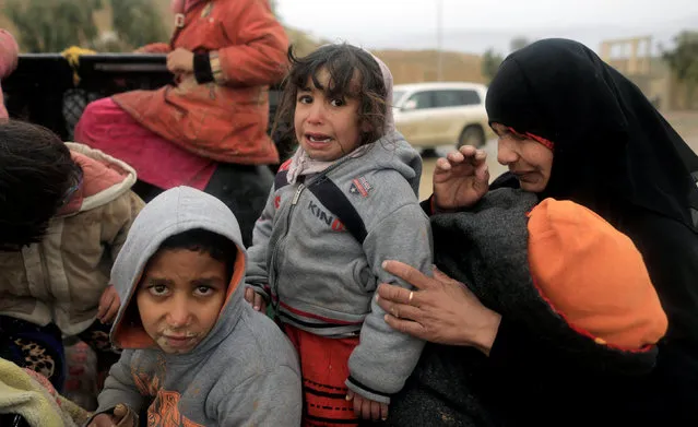 A displaced Iraqi woman and her daughter cry while fleeing their homes, as Iraqi forces battle with Islamic State militants in western Mosul, Iraq, March 4, 2017. (Photo by Zohra Bensemra/Reuters)