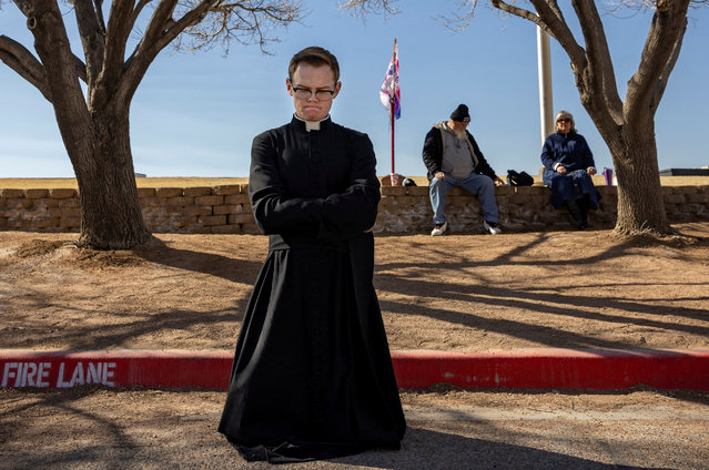 A priest in training protests abortion outside the Women's Reproductive Clinic of New Mexico, in Santa Teresa, U.S., January 13, 2023. The abortion clinic, just over the border with Texas, where abortion is illegal since Roe v. Wade was overturned, provides medical abortions for women who are flying and driving hundreds of miles across Texas. (Photo by Evelyn Hockstein/Reuters)