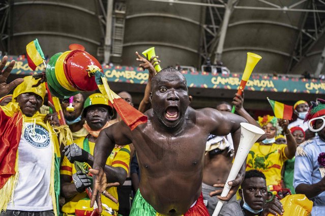Mali supporters cheer ahead of the Group F Africa Cup of Nations (CAN) 2021 football match between Mali and Mauritania at Stade de Japoma in Douala on January 20, 2022. (Photo by Charly Triballeau/AFP Photo)
