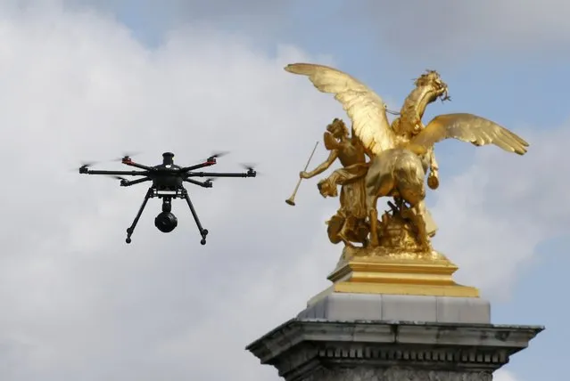 A police surveillance drone flies over a demonstration against the French labour law proposal in Paris, France, May 3, 2016 as the labour reforms law reaches parliament today with 5,000 amendments to be discussed. (Photo by Gonzalo Fuentes/Reuters)