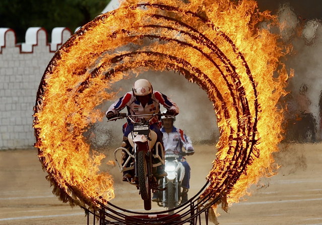 Indian Army Jawan (soldiers) of the “ASC Tornadoes” daredevil bike team perform during Independence Day celebrations in Bangalore, India, 15 August 2024. India celebrated its 78th Independence Day on 15 August. (Photo by Jagadeesh N.V./EPA)