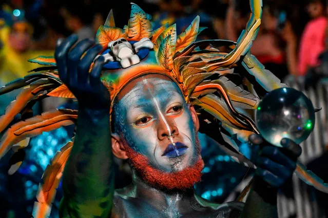Revelers perform during the Myths and Legends parade in Medellin, Antioquia department, Colombia on December 8, 2019. (Photo by Joaquin Sarmiento/AFP Photo)