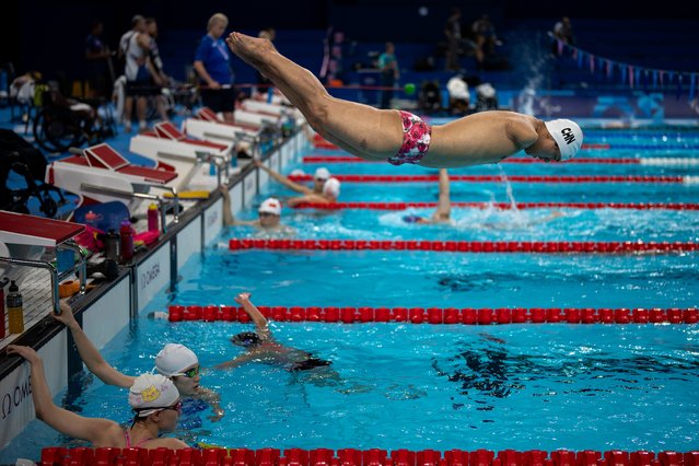 Yuan Weiyi, from China, jumps into the pool during a training session ahead of the 2024 Paralympics, Tuesday, August 27, 2024, in Paris, France. (Photo by Emilio Morenatti/AP Photo)