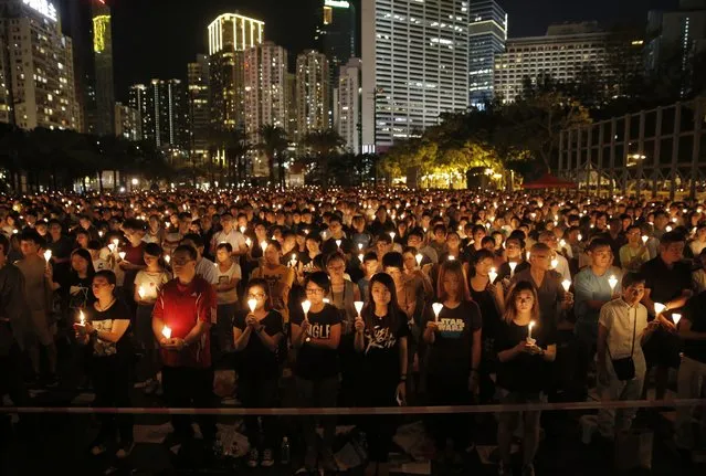 Tens of thousands of people attend a candlelight vigil at Victoria Park in Hong Kong, Saturday, June 4, 2016, to commemorate victims of the 1989 military crackdown in Beijing. China's bloody crackdown on the Tiananmen Square pro-democracy protests was a pivotal moment in the country's political development. Despite the Communist Party's efforts to erase memories of the event, every year its anniversary triggers heightened security and surveillance on the mainland, along with furtive commemorations by a handful of activists. (Photo by Kin Cheung/AP Photo)