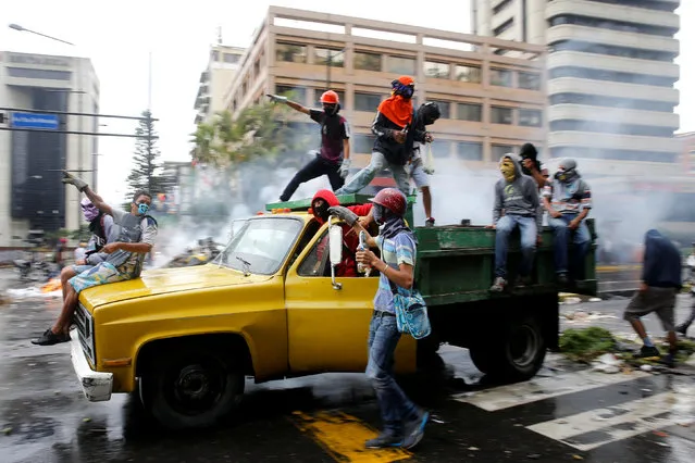 Demonstrators ride through the city during protests against President Nicolás Maduro’s government in Caracas, Venezuela on June 29, 2017. The chief prosecutor, Luisa Ortega Díaz, has been barred from leaving the country and her bank accounts frozen by the supreme court after her mounting criticism of the president. (Photo by Ivan Alvarado/Reuters)