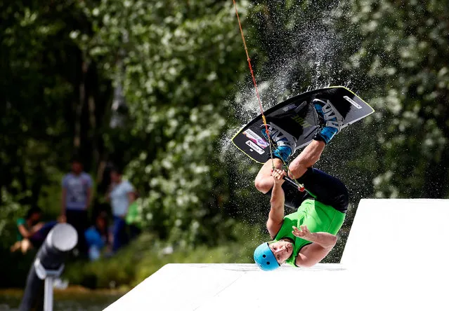 A man takes part in Belarus Wakeboard Cup in Minsk, Belarus June 18, 2016. (Photo by Vasily Fedosenko/Reuters)