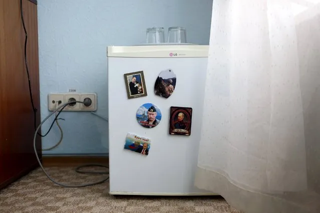 Magnets with pictures of Russian President Vladimir Putin on them are seen on a fridge in this photo illustration taken in a hotel room in Kazan, Russia, July 24, 2015. (Photo by Stefan Wermuth/Reuters)