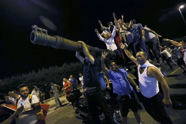 People stand on a Turkish army tank at Ataturk airport in Istanbul, Turkey July 16, 2016. (Photo by Reuters/Stringer)