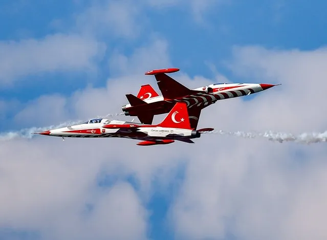 Aerobatic demonstration team of the Turkish Air Force, “Turkish Stars”, perform during the “TEKNOFEST Azerbaijan”, the Aviation, Space and Technology Festival, at Baku Crystal Hall and Baku Boulevard in Baku, Azerbaijan on May 26, 2022. (Photo by Mustafa Ciftci/Anadolu Agency via Getty Images)
