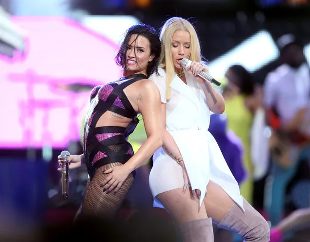 Recording artists Demi Lovato (L) and Iggy Azalea perform on the Pepsi Stage, during the 2015 MTV Video Music Awards, at The Orpheum Theatre on August 30, 2015 in Los Angeles, California. (Photo by Frederick M. Brown/Getty Images for MTV)