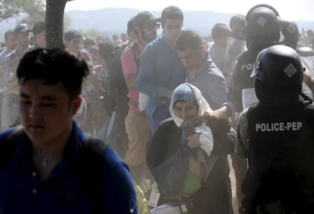 Migrants enter Macedonia near Gevgelija after crossing the border with Greece September 2, 2015. (Photo by Ognen Teofilovski/Reuters)